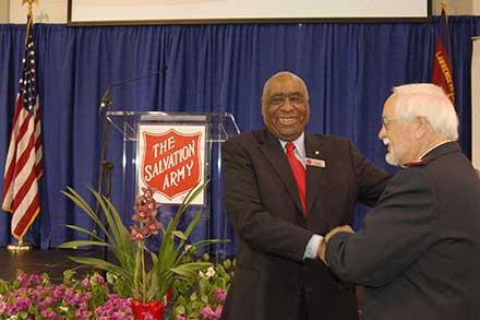 L. C. Johnson (Left), Gwinnett County resident, donates much of his time to help others and has been a father figure to many. Pictured is L.C. Johnson (L) with Major Glenn Fite (R), retired Salvation Army Officer.