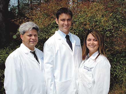 Dr Louis Jimenez (L) works with son Dr Dorian Jimenez and daughter Dr Margo Jimenez-Menke at Gwinnett Foot and Ankle.