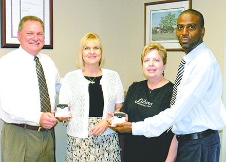 Lilburn Postmaster Jeffrey Keever and Mike Eubanks presented LWC President Patty Gabilondo and Cheryl Bauer with one black and one red ink official USPS cancellation stamp commemorating the GFWC Lilburn Woman's Club 40th Anniversary being chartered with GFWC Georgia.  Available for general public use at the Lilburn Post Office located on Lawrenceville Hwy.