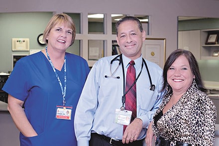 Glancy Rehabilitation Center’s Medical Director Sunil Bhole, MD, (center) started the program in 1988. He is pictured with Ginger Geiger, RN, CRRN, nursing manager (left) and Mona Lippitt, CTRS, program director. Geiger has also worked at the center since it opened.