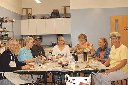 Hot'lanta Gourd Patch at their monthly meeting at The Jacqueline Casey Hudgens Center for the Arts. Inset: Gourds take many forms in the talented hands of the gourd artists. Tina Shumake Handrop (3rd from right).