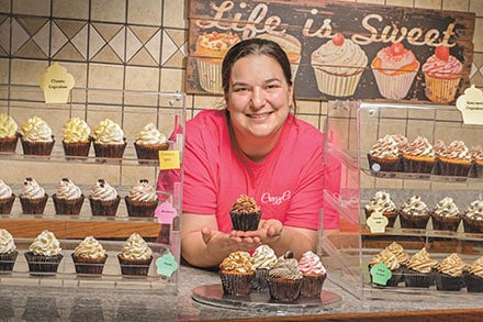 Andrea Ide, GGC graduate, in her cupcake shop