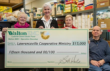 The Lawrenceville Cooperative Ministry serves people in need in the Lawrenceville and Dacula areas. "Donations are down, while at the same time, we're seeing a rise in homelessness," says director Linda Freund. "This donation will help people in need with things like prescription medicine, water bills and places to stay for homeless families." Check out their website at lawrencevilleco-op.org. Shown in the ministry's food pantry are, from left, Walton Electric Trust Board Member Nancy Abbott, Freund, Trust Board Member Anna Shackelford and ministry volunteer Dirck Dillehay.