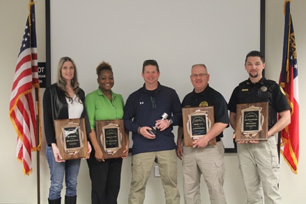 Pictured L to R: Officer Crystal Findura, Detective Teria Russell, Sgt. Steve Walker, Lt. Robert Montgomery, and Officer Tony Thaxton