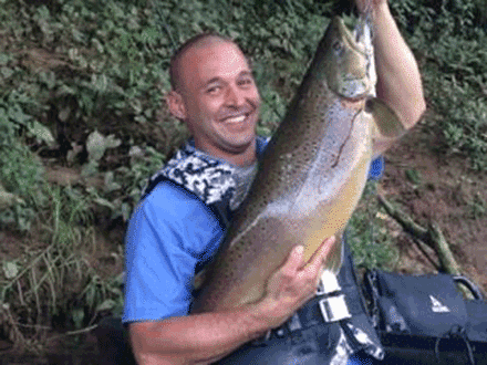 Chad Doughty sets new state record with big brown trout
