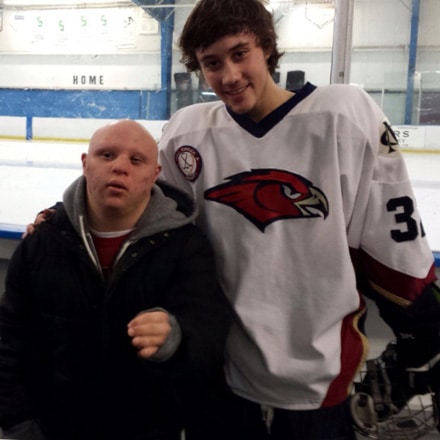 Ethan is a champion hockey player. Austin enjoys attending his games.