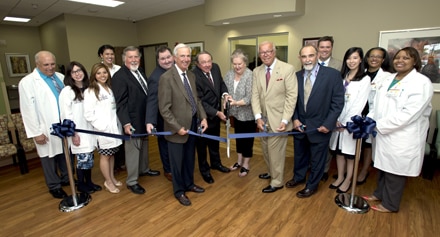 GMC leadership along with Clyde and Sandra Strickland (center) and the family medicine residents participate in the ceremonial ribbon cutting at the Strickland Family Medicine Center, a  9,400-square-foot facility that features 10 exam rooms. It is the primary outpatient training facility for the family medicine residency program. 