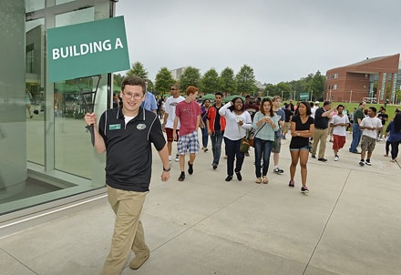 Georgia Gwinnett College Student Ambassador Christopher Young leads a group of new students to Building A, one of the college's academic buildings. This guided tour was part of the college's first "Path to Success Day."