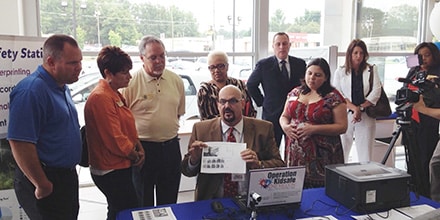 Snellville City officials gathered at Stone Mountain Volkswagen to get a look at the Operation Kidsafe program