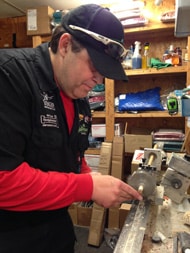 Scott working a cue on the lathe in his shop