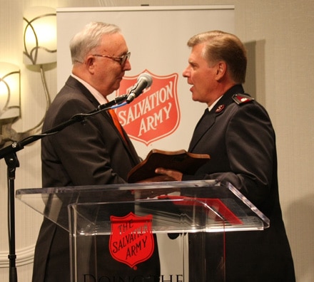 Elliot Brack (left) accepts prestigious “Others” Award from Commissioner David Jeffrey, National Commander of the Salvation Army USA.