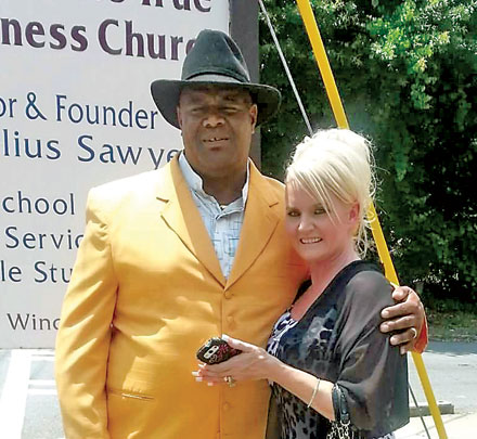 Joe Sawyer and his wife, Kimberly outside of Saint Peter's True Holiness Church