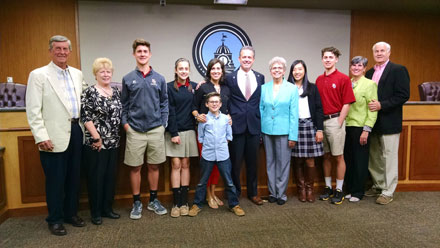Chuck Warbington and his family with Mayor Judy Jordan Johnson