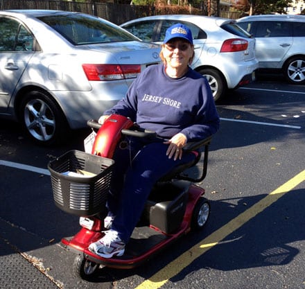 FODAC client Elizabeth King enjoying the mobility of the power chair she received from the organization.