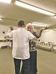 Farrar Atkinson shared a dance with Roli Abucay, a former student now living in Toronto, Canada.