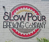 Slow Pour Brewing Company is located in Lawrenceville Ga by the railroad tracks in an historic 106 year-old building.