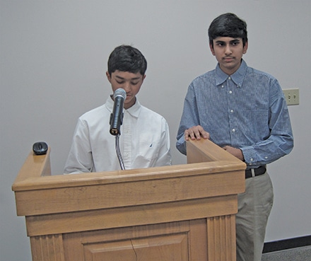 Nimish Kadam and Simarth Mishra address Dacula City Council during  a recent council meeting on raising thrombosis awareness.