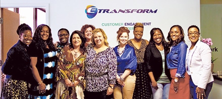 The August 12, 2017 e-Transform co-working launch photo includes members of Woman University as well as key women committed to making this unique workplace solution a success.