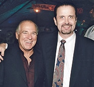 In the music business, Burkhalter’s (R) career brought him shoulder-to-shoulder with music legends, like Jimmy Buffett (L)