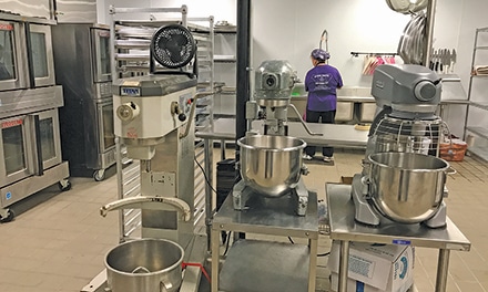 Special Kneads and Treats, Inc., staff enjoy baking and decorating goodies in the new 2,600 square foot kitchen.