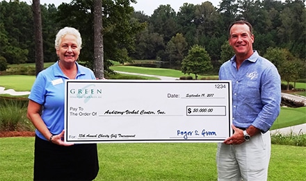 Green Financial donated $50,000 to the Auditory Verbal Center (AVC). Pictured is Roger Green and Debbie Brilling, Executive Director and CEO of AVC.