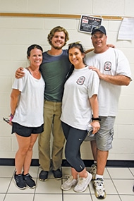 John Paul Kakos (center) stands proudly with his mom, Tracy; sister, Lauren; and dad, Paul as they support him on set at Mountain View High School. The family is wearing the official Full Count Movie production t-shirts with the #8 in memory of John Paul’s uncle who was a big mentor in his life.