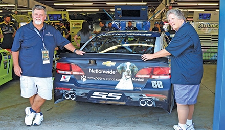 Tom Murphy, sporting a NASCAR “Hot” all-access pass, posed with the #88 car in the garage, just before the inspections took place