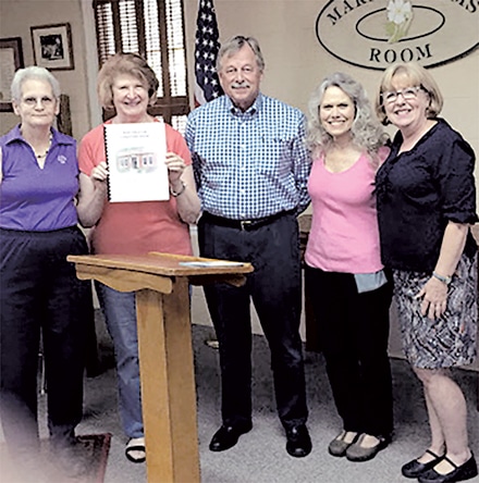 Historic Preservation Architect Eugene Barrington presents first phase of Conditions Assessment Report to Norcross Woman’s Club Restoration Steering Committee Members. Shown with Barrington (L-R) Carol Hitchcock, Anne Webb, Rebecca Norcross, and Carol Bryant.