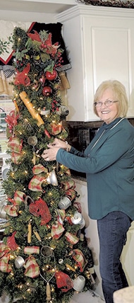 Brenda Bedingfield shows off her Old Fashion Utensil Tree in her kitchen