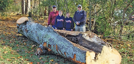 Large portion of the tree saved for a table top. (L-R) Chad Smith, Rett Smith, Clay Smith, Don Smith