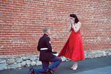 David King gets on one knee to propose to Kate Awtrey in Nov. 2013.