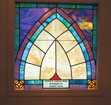 Beautiful stained glass windows This stained glass window was donated to the church in memory of Hubert Paris. Several windows in the church, all different in design, are placed honoring a deceased member her or family.