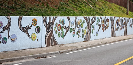 The Mitchell Road Mosaic Wall, a community effort first conceptualized in 2014, is now complete after more than 1000 students, teachers and volunteers took part in its creation.