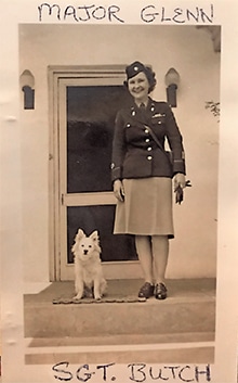 Major Glenn fell in love with Butch, the unit’s canine mascot. The enlisted officers helped her smuggle Butch out of Brussels, Belgium on a ship, stowing him away in a duffel bag with air-holes cut out of it.