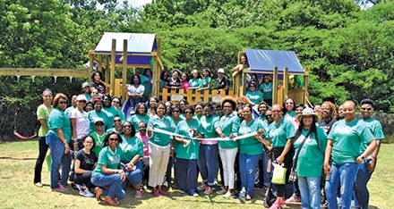 Attendees at the playground rebuild and dedication.