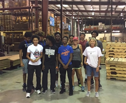 Members of the Central Gwinnett High basketball team along with Foundation staffers Donna Zimmer and Daniele Aurandt.