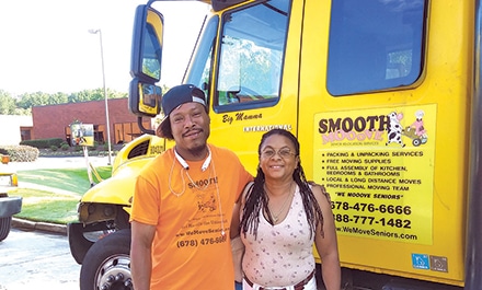 Adrienne Simpson-Peppler, owner of Smooth Mooove, with her Crew Supervisor, Patrick.