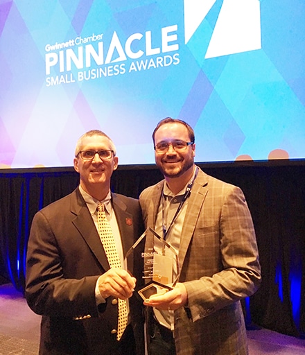 From left, Snellville Economic Development Director Eric Van Otteren and Josh Sweeney of GarageWorx at the Gwinnett Chamber’s 2018 Pinnacle Small Business Awards luncheon and ceremony Tuesday.