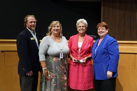 Lawrenceville Mayor Judy Jordan Johnson, second from right, receives the Georgia Recreation and Park Association Volunteer of the Year award from GRPA Executive Director Steve Card, from left, Gwinnett County Community Services Director Tina Fleming and county commission Chairwoman Charlotte Nash.