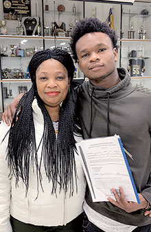 Proud mother Emunet Momodu and her son Farid, a junior, who won first place for the Creative Writing Category at the Nancy Gullickson Fine Arts Competition