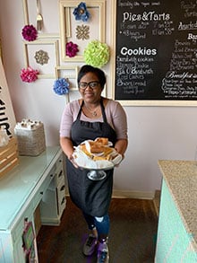  Danielle Bonaparte holds some of their customer favorites, "Butter bars". The crumbly treat has a creamy filling that comes in flavors including chocolate, pecan pie, banana pudding and lemon.