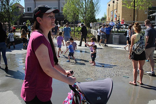  As the mayor’s speech ended, a fountain bubbled and children rushed into the water at Peachtree Corner's new Town Green.