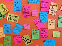 At Sweet Joy Ice Cream Bar, there is a collage of stickies and post-it notes left by patrons, friends, and guests.