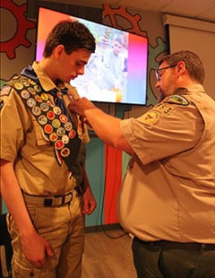 Everett Somers receiving his Eagles Scout pin.