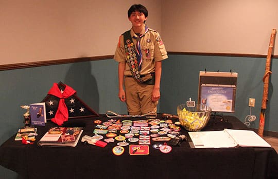 Blake Ito stands proudly shows the work he did to become an Eagle Scout. Blake became an Eagle in January of 2019 and helped build four benches for the Kindergarten Playground at a local elementary and helped with additional maintenance work around the school. He spent more than 100 hours completing the project.