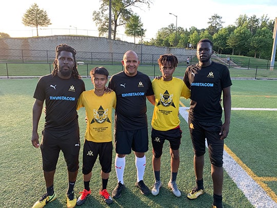 The Kalonji Soccer Academy ranks number one in the GA Youth Soccer Association. L-R: Coach Borfor "Bof" Carr, Daniel Vahnie (Right Defender), Coach Bruno Kalonji, Siem Beraki (Central Midfielder) and Coach Santino Jerke.