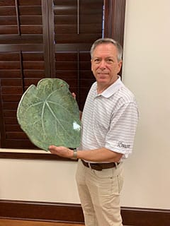 Richard Shivers of "A Measure of Clay" creates and sells unique pottery out of his home studio in Buford. Here he holds his leaf tray, hand-built by stamping a real leaf onto the clay and adding attachments.
