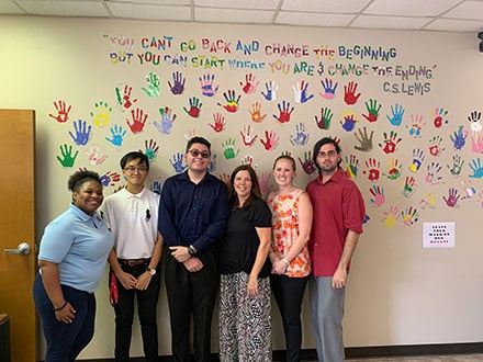 Hearts to Nourish Hope staff. L-R: Ericka Leslie, Career Case Manager; Kevin Vu, Intern; Oscar Parada, Intern; Patrice Wuerth, COO; Royale Schoepf, Counselor, and Timothy Whailen, LMSW.