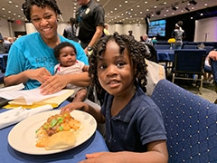 A family enjoys dinner at First Baptist Chruch Snellville.