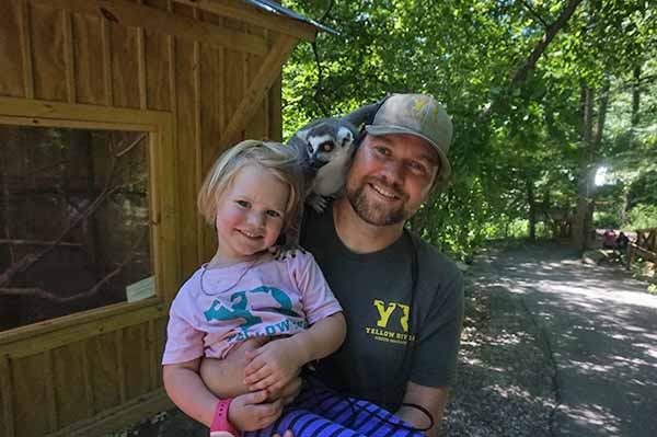 Julianne, the ring-tailed lemur with the l-o-o-o-n-g tail, loves to climb on anything, and that includes Yellow River Wildlife Sanctuary owner Jonathan Ordway. Julianne is the favorite animal of little Ivey, daughter of Katy and Jonathan.
